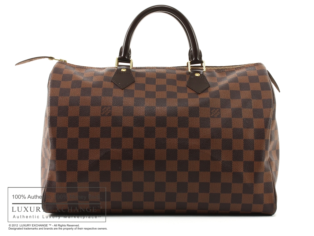 Louis Vuitton's “Brown and Beige Damier”, and Michael Kors “Checkerboard.”  “Who wears it Better.” – Qt Qouture